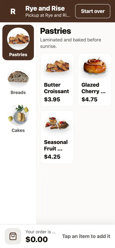 A guest's phone on a bakery's menu, with pastries, bread, and cakes, each with a photo and a price.