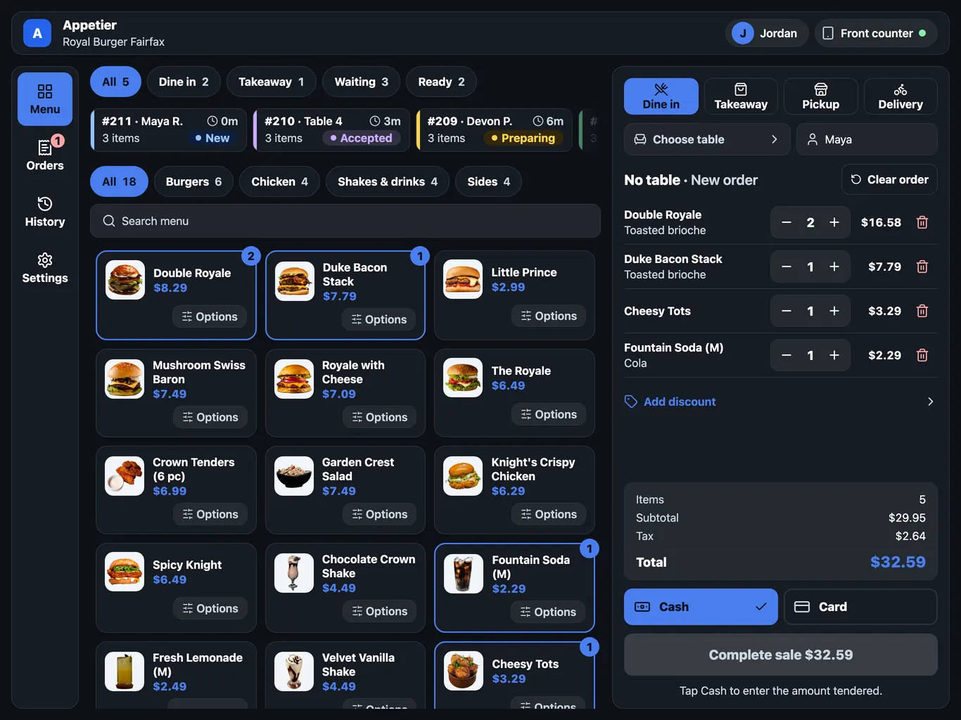 The Appetier POS sale screen on a countertop tablet on a stand. A menu of burgers, chicken, and shakes fills the left, and the bill on the right lists five items with subtotal, tax, and total above Cash and Card buttons.